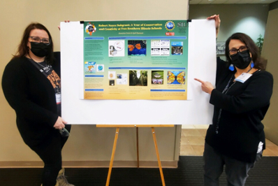 Meteicha Green and April Bartnick standing next to their conference poster titled, "Robert Noyce Subgrant: A Year of Conservation and Creativity at Two Southern Illinois Schools"